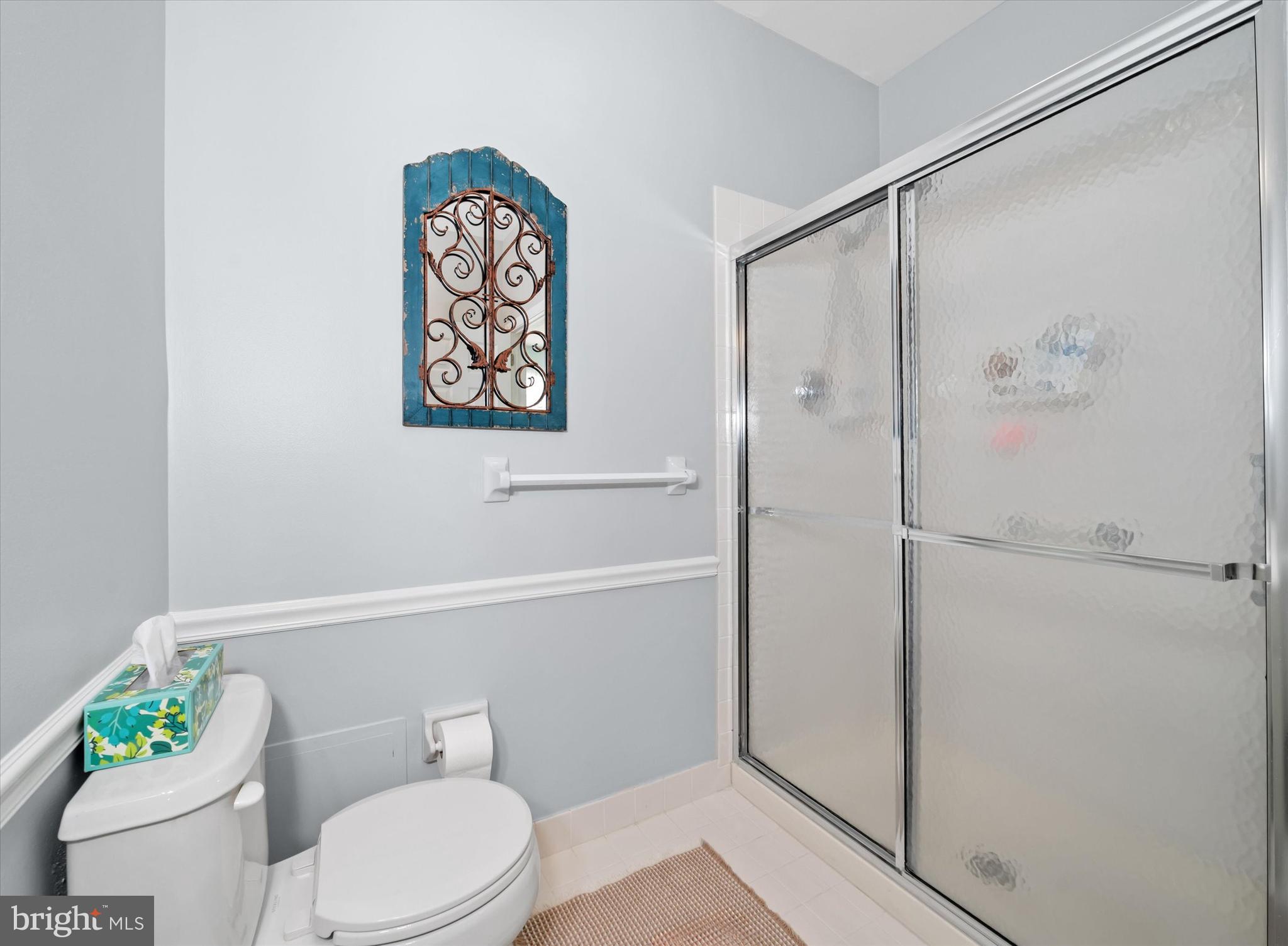 20 Hunters Way Glen Mills, PA 19342 - Photo 24 of 36 a white toilet sitting next to a bathroom sink and a shower