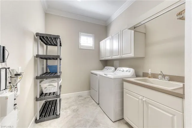 a utility room with closet dryer and washer