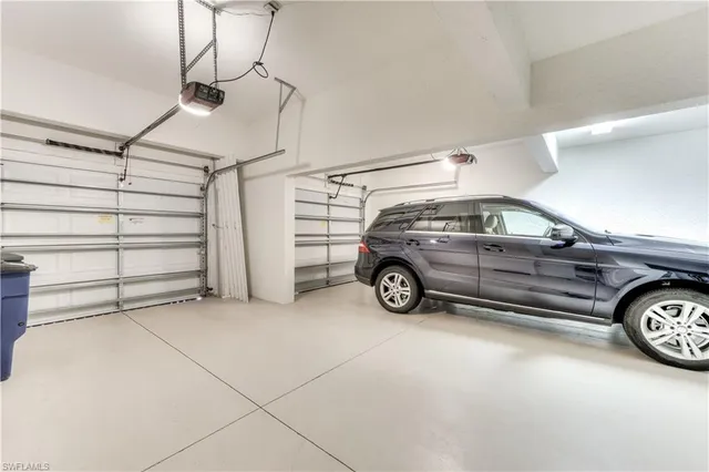 a view of a garage and car parked