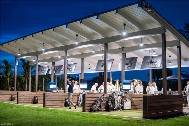 a group of people sitting in a yard