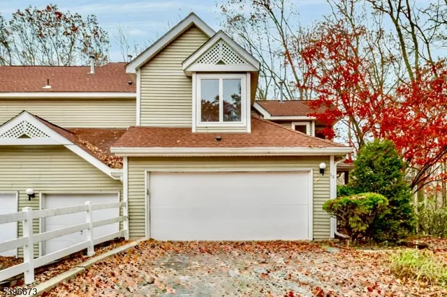 a view of a house with a garage