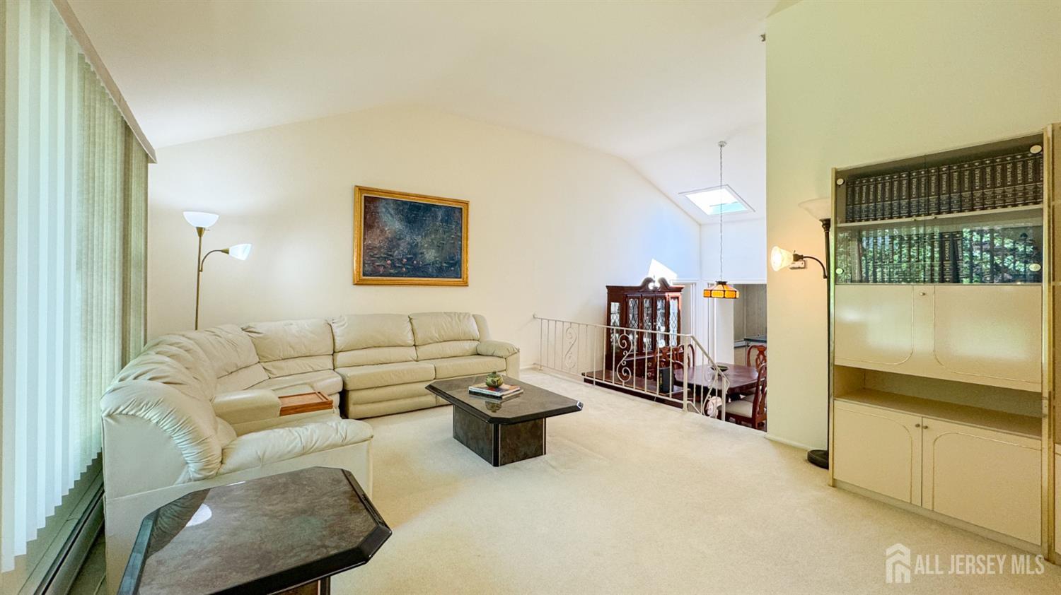 25 Sherwood Road Edison, NJ 08820 - Photo 15 of 25 a living room with furniture a flat screen tv and a window