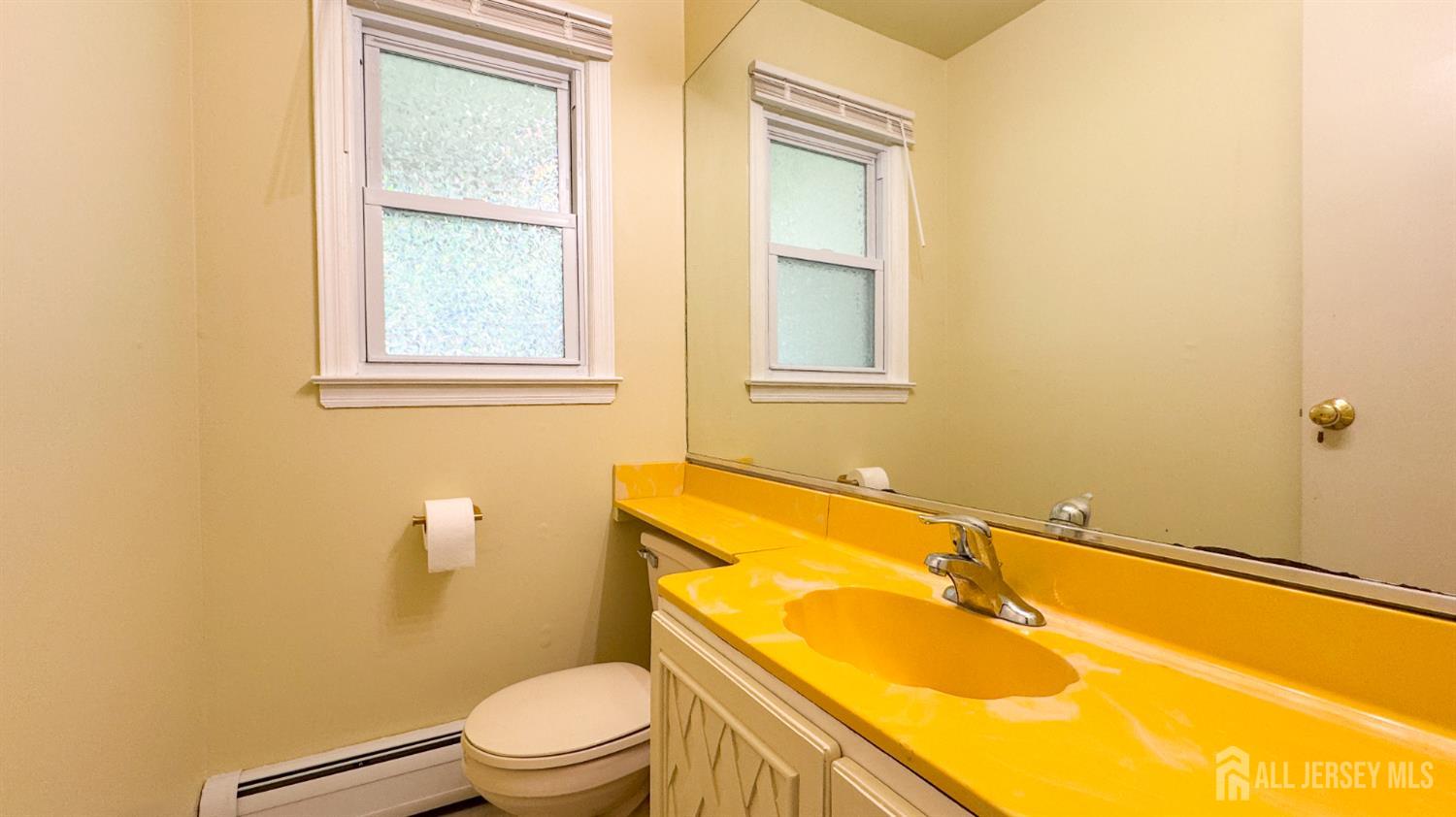 25 Sherwood Road Edison, NJ 08820 - Photo 18 of 25 a bathroom with a sink and a toilet