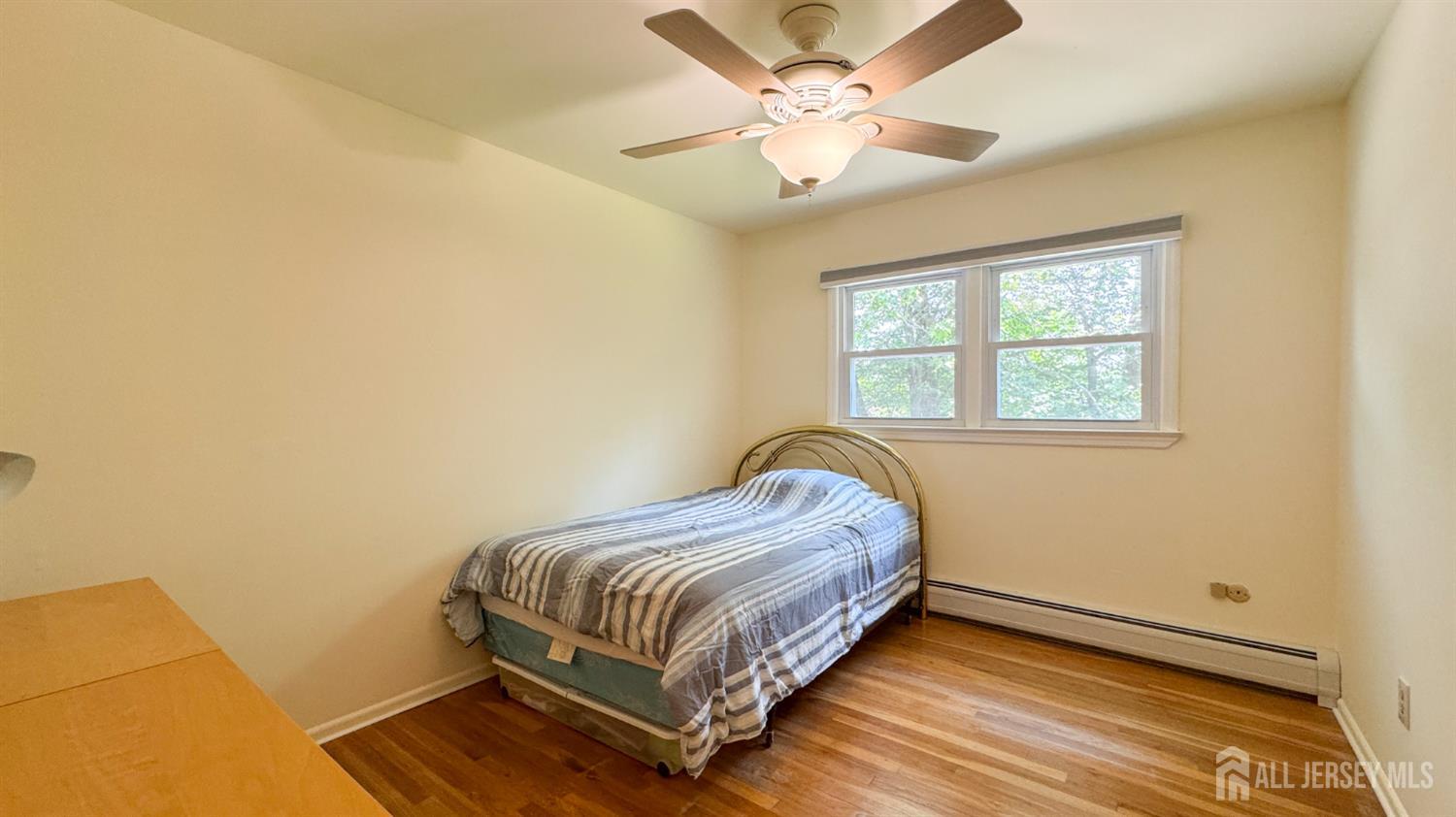 25 Sherwood Road Edison, NJ 08820 - Photo 20 of 25 a bedroom with a bed and window