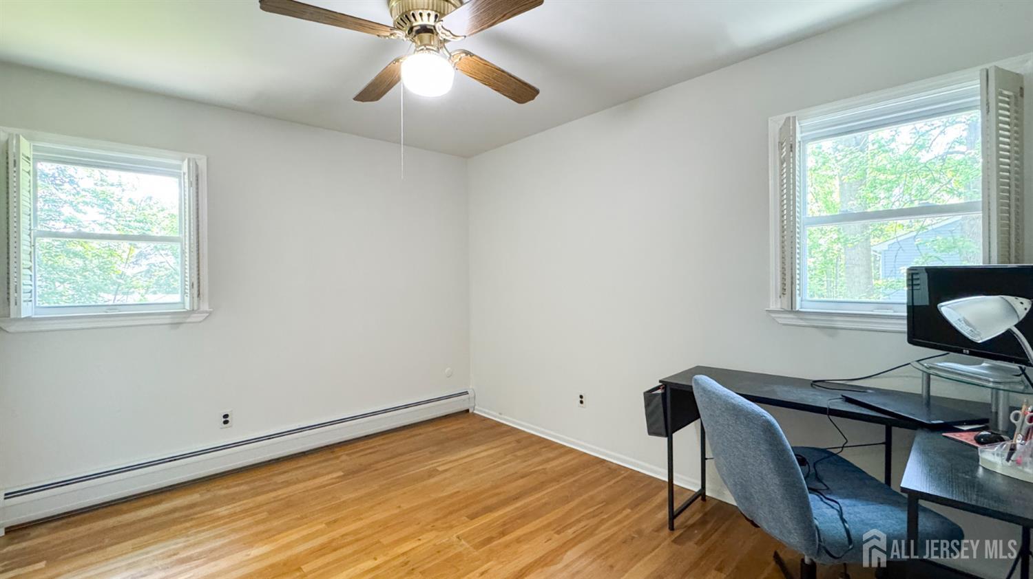 25 Sherwood Road Edison, NJ 08820 - Photo 21 of 25 a view of a workspace with furniture and a window