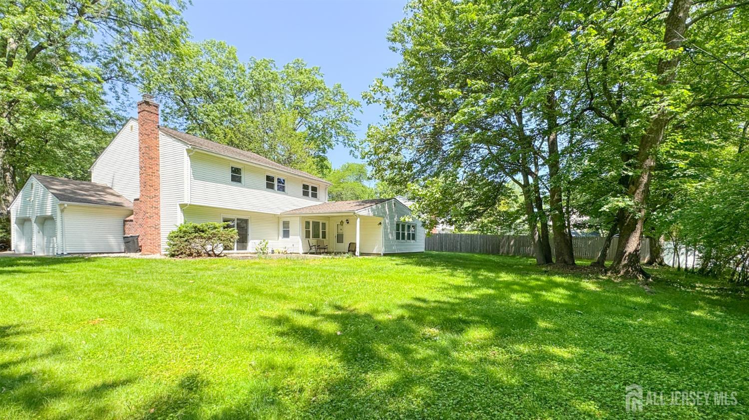 25 Sherwood Road Edison, NJ 08820 - Photo 24 of 25 a front view of a house with a garden