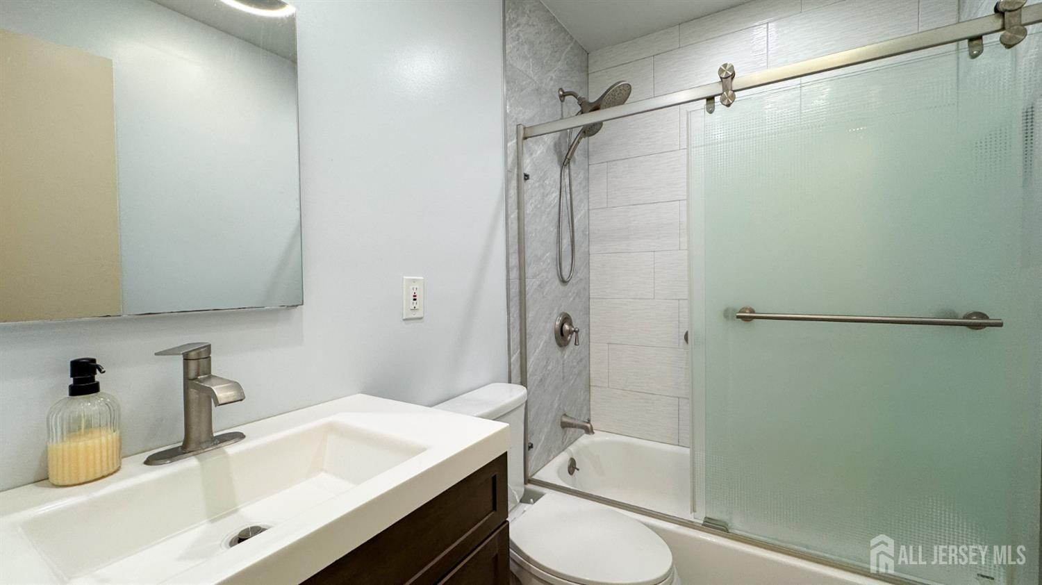 25 Sherwood Road Edison, NJ 08820 - Photo 8 of 25 a bathroom with a sink toilet and shower