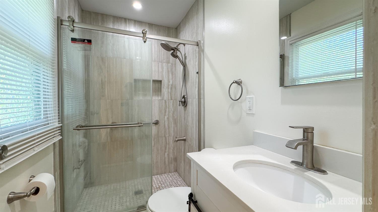 25 Sherwood Road Edison, NJ 08820 - Photo 9 of 25 a bathroom with a sink toilet and shower