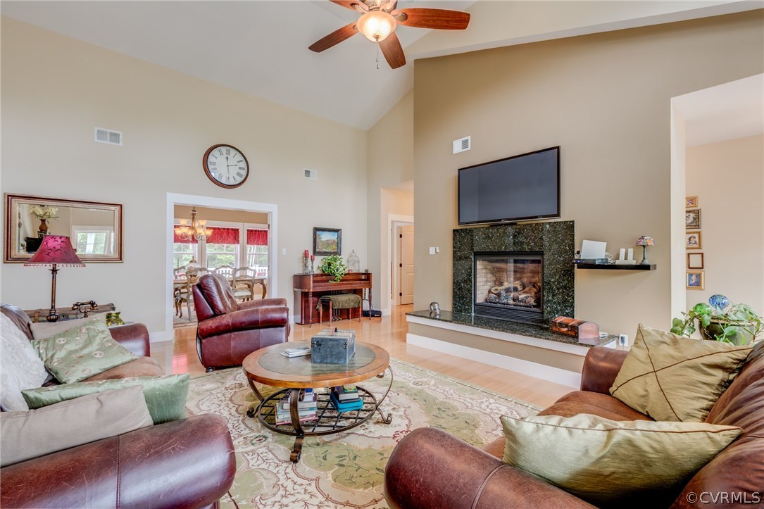 3401 Mill Quarter Road Ford, VA 23850 - Photo 17 of 34 a living room with furniture a fireplace and a flat screen tv