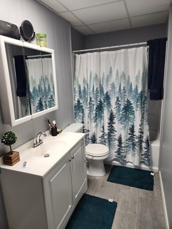 280 Ridge Street Fall River, MA 02721 - Photo 3 of 13 a bathroom with a sink toilet and mirror