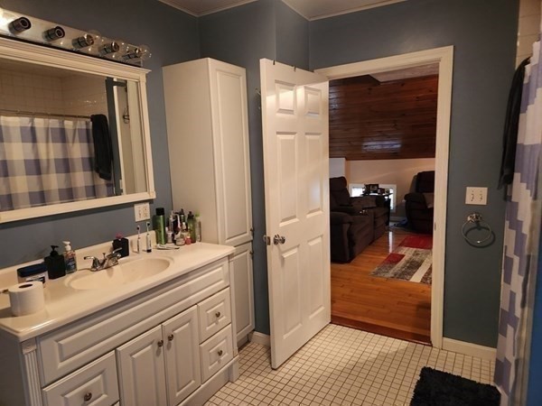 280 Ridge Street Fall River, MA 02721 - Photo 9 of 13 a bathroom with a sink and a mirror