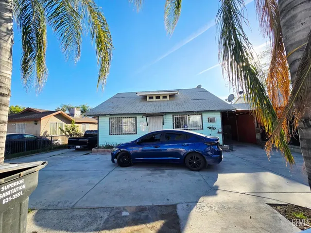 a front view of a house with parking space