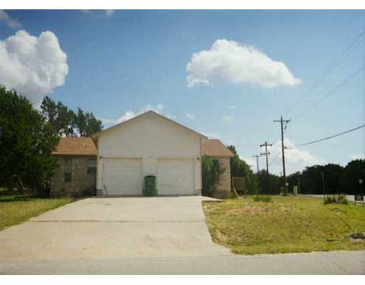 7308 Bar K Ranch Road Lago Vista, TX 78645 - Photo 1 of 1 a view of a backyard