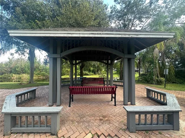 a view of a yard with large trees