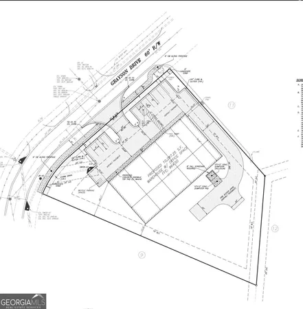 a picture of white wall with a white comforter