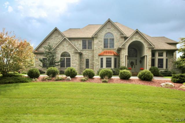 410 Colver Road Nazareth, PA 18064 - Photo 1 of 13 a front view of a house with yard and green space
