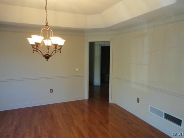 410 Colver Road Nazareth, PA 18064 - Photo 5 of 13 a view of a room with wooden floor and chandelier