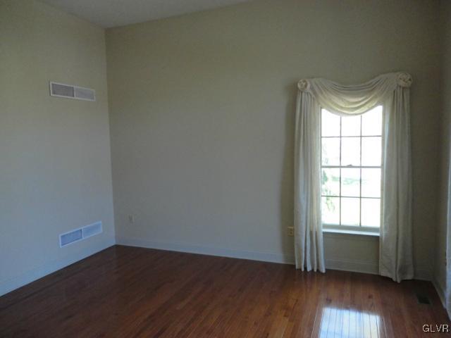 410 Colver Road Nazareth, PA 18064 - Photo 6 of 13 an empty room with wooden floor and windows