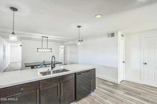 a bathroom with a sink double vanity and a mirror