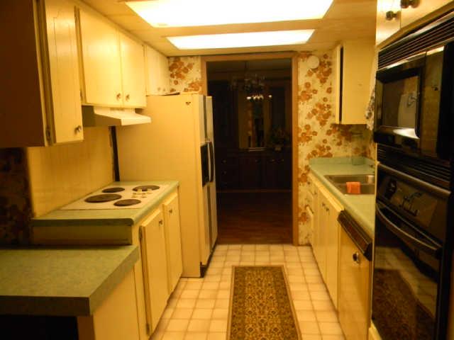 4805 Banner Adams Road College Grove, TN 37046 - Photo 19 of 20 13'1"x8' galley style kitchen with another section that has a countertop and cabinets not included in the dimensions.