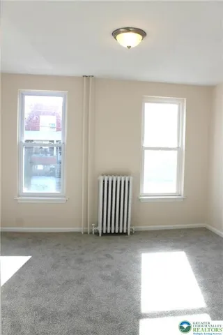 an empty room with windows
