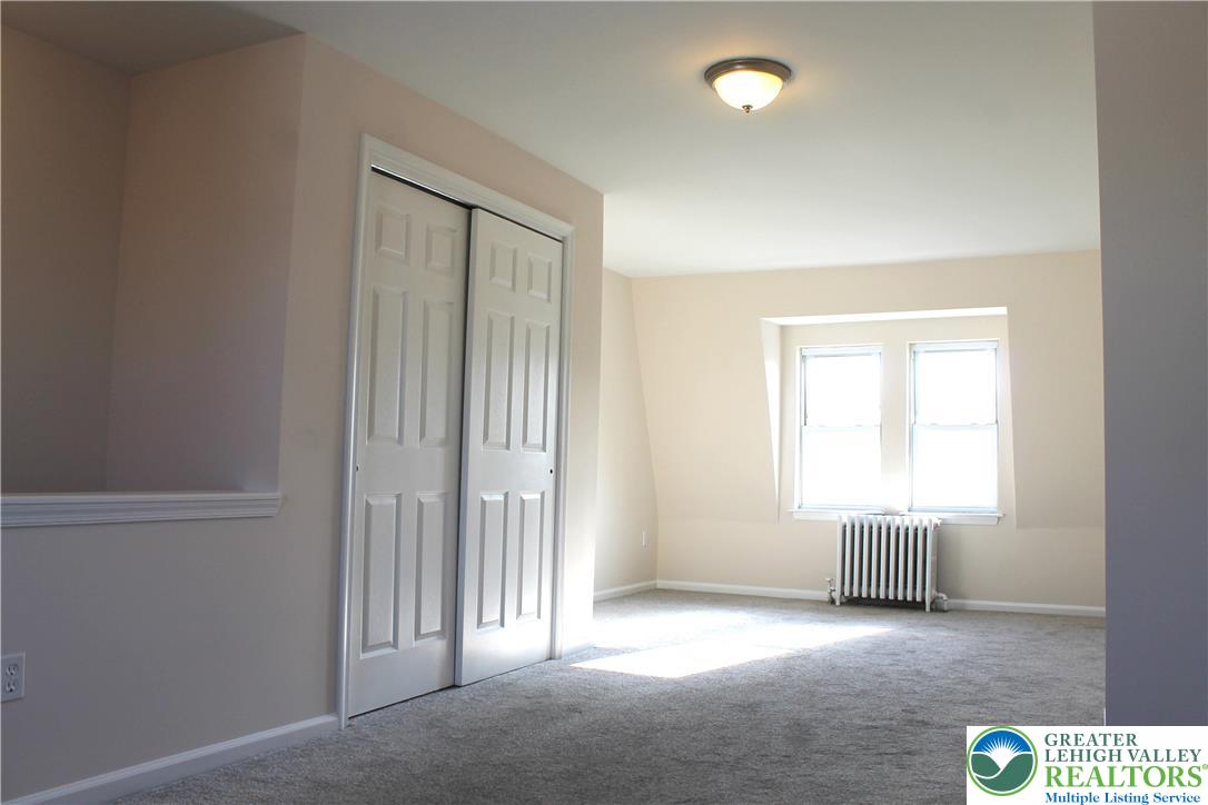 815 Greenleaf Street Allentown, PA 18102 - Photo 13 of 13 an empty room with windows and cabinet