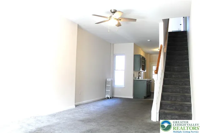 a view of a hallway with a bathroom