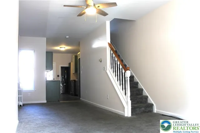 a view of a hallway with staircase