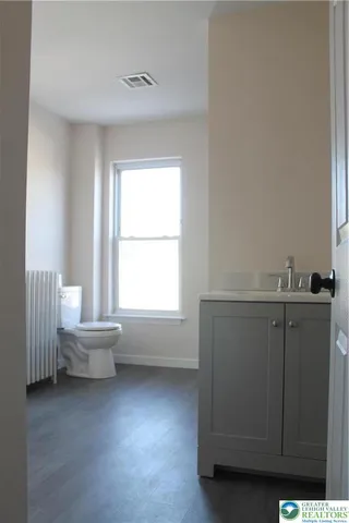 a room with a window and cabinet