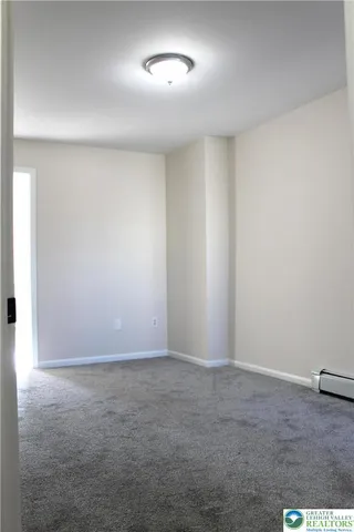 an empty room with a empty space and a window