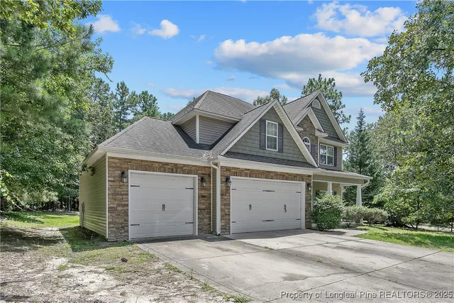 a front view of a house with a garage
