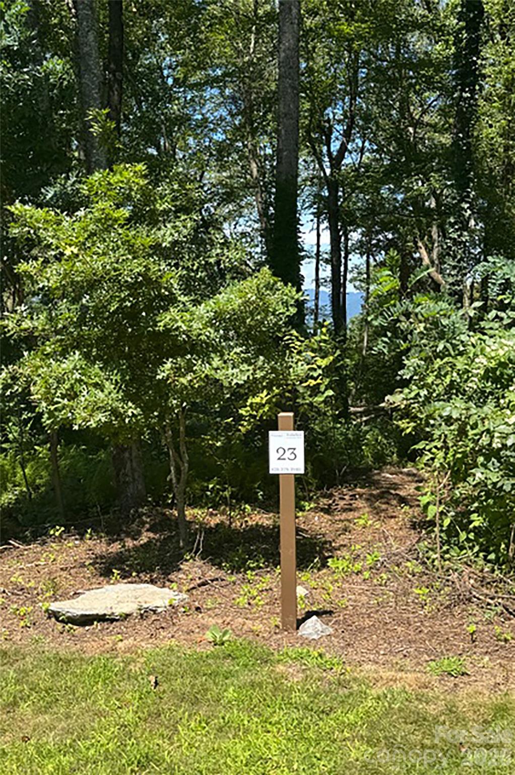 0 Laurel Ledge Way, Unit 23 Fletcher, NC 28732 - Photo 9 of 24 a sign board with tall trees
