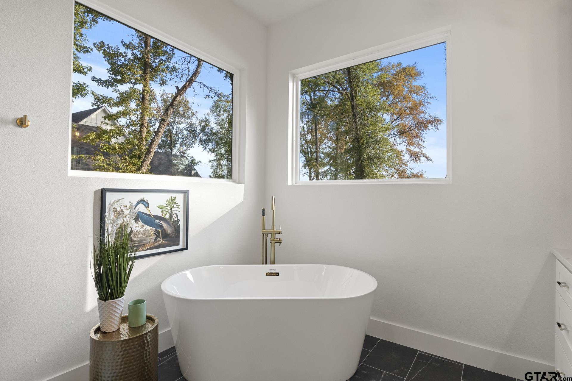 641 North Private Road Leesburg, TX 75451 - Photo 15 of 44 a white bath tub sitting next to a white sink