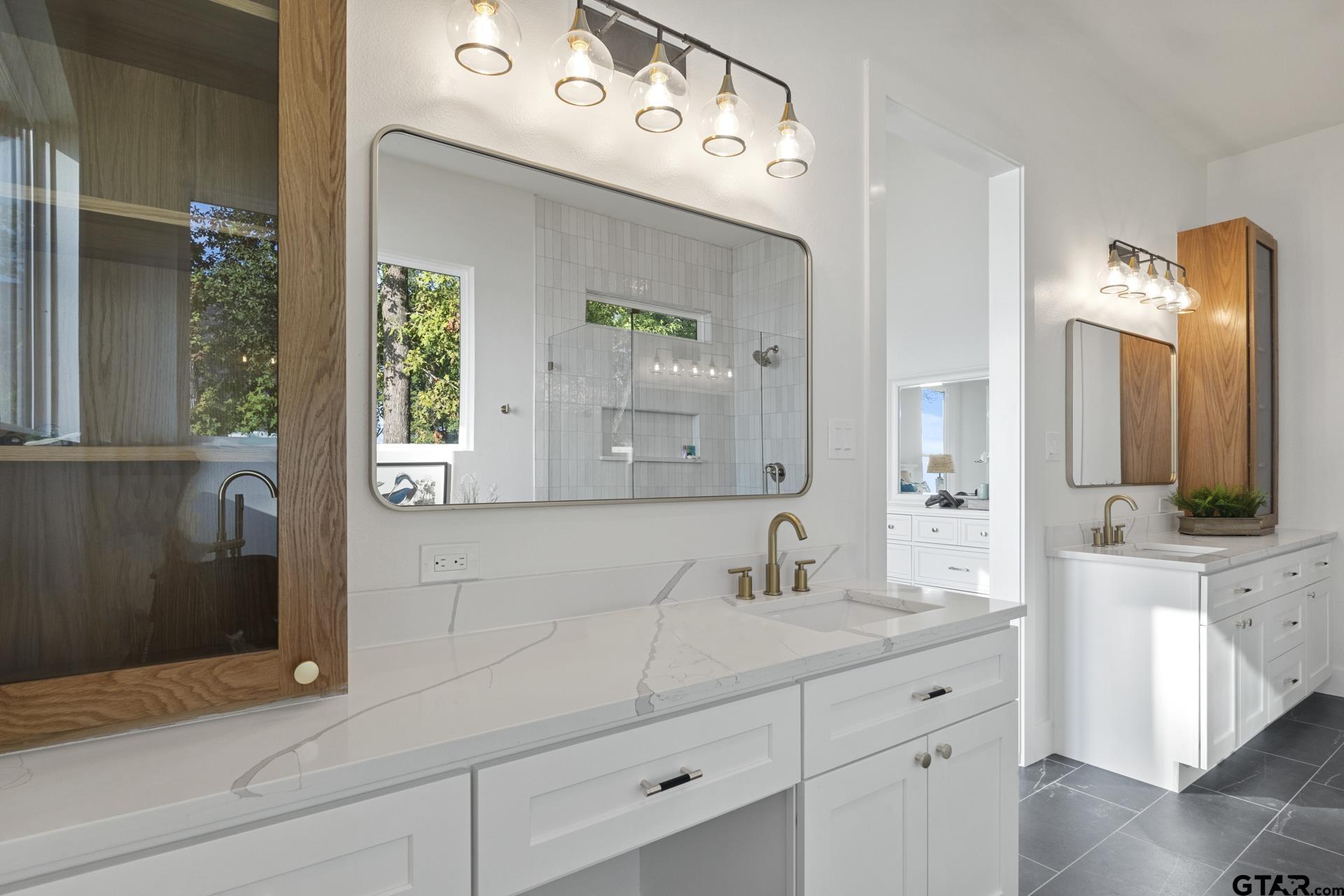 641 North Private Road Leesburg, TX 75451 - Photo 16 of 44 a bathroom with a sink and a mirror