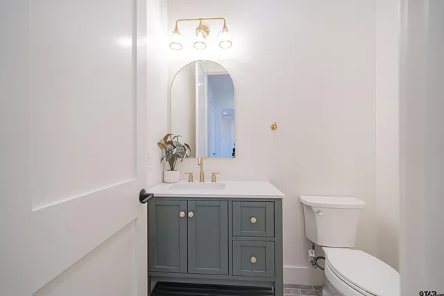 a view of a bathroom from a hallway