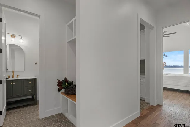 a bedroom with furniture and a wooden floor