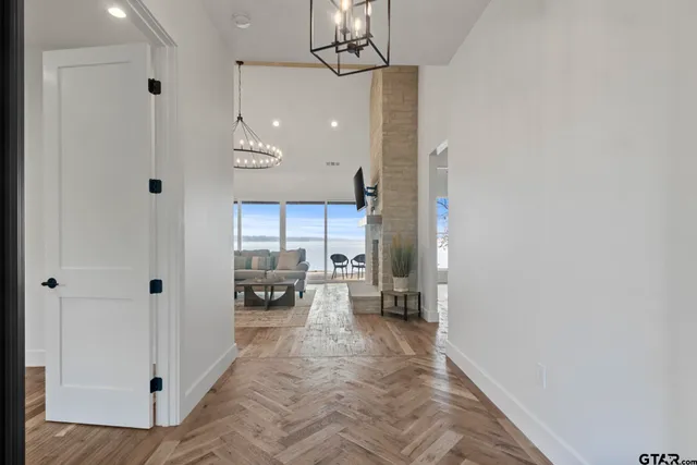 a very nice looking room with a large window and chandelier