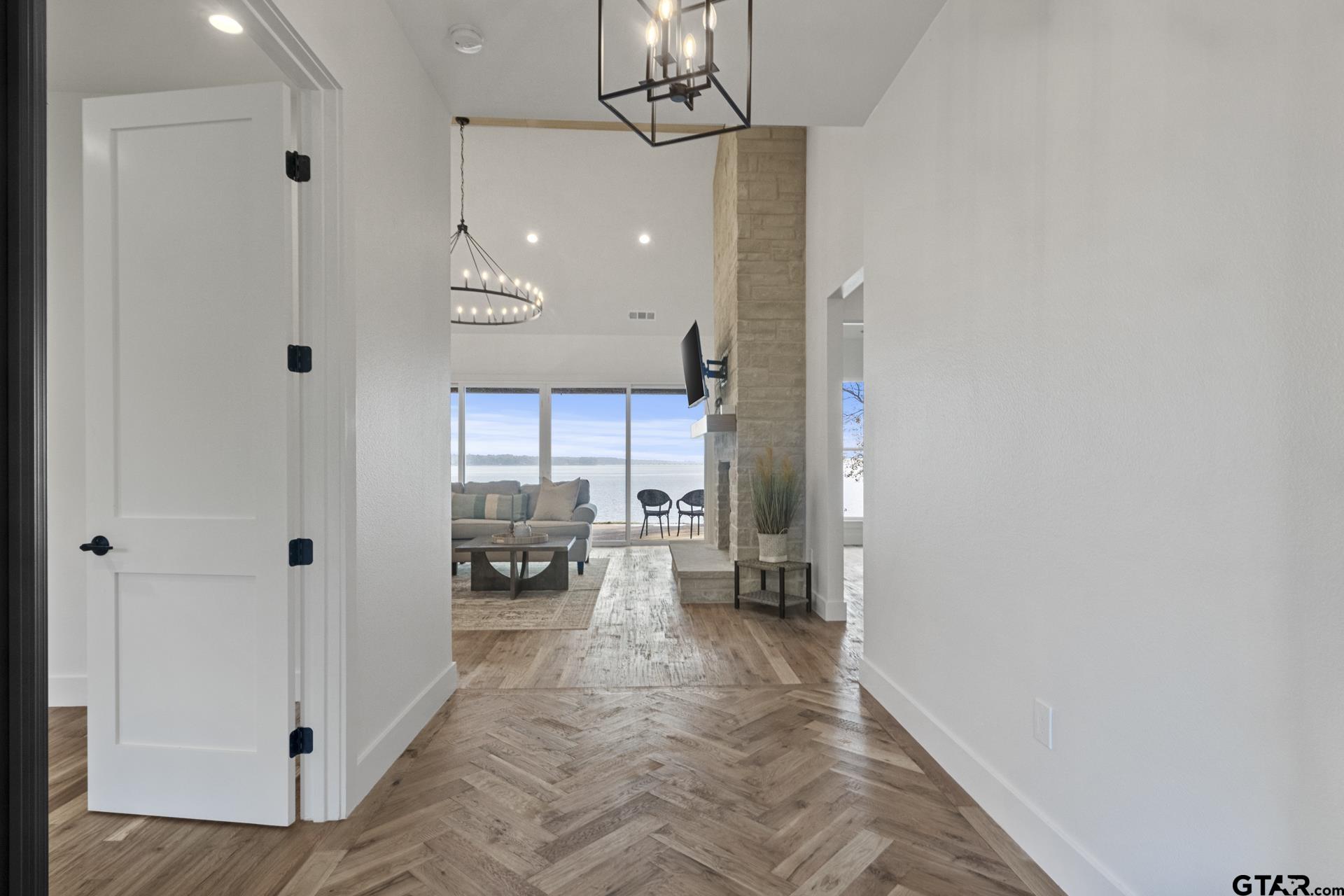 641 North Private Road Leesburg, TX 75451 - Photo 6 of 44 a very nice looking room with a large window and chandelier