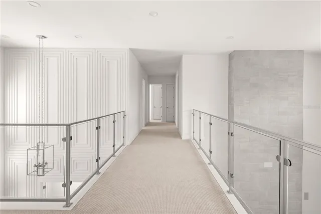 a room with wooden floor and potted plant