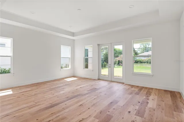 a kitchen with a stove a refrigerator and cabinets