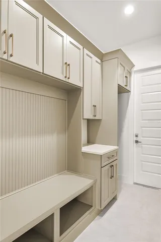 a bathroom with a sink a shower and a mirror