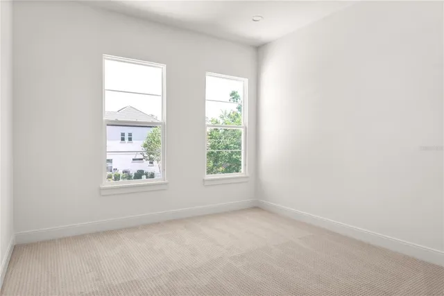 a view of a kitchen with large windows