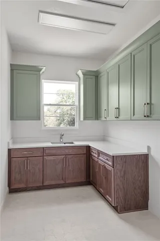 a stove top oven sitting inside of a kitchen