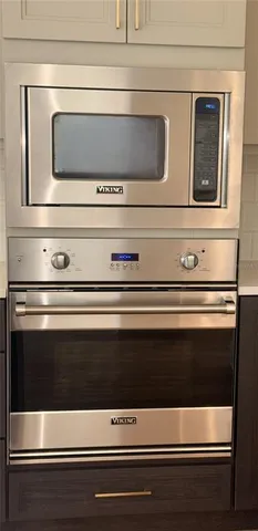 a close view of walk in closet with rug