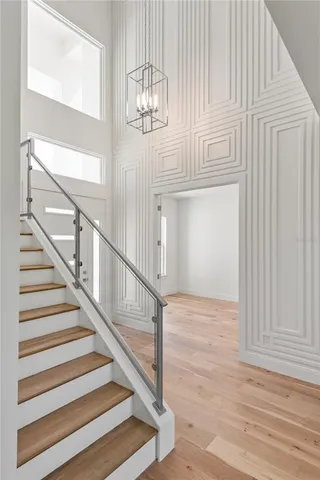 a view of entryway wooden floor and front door