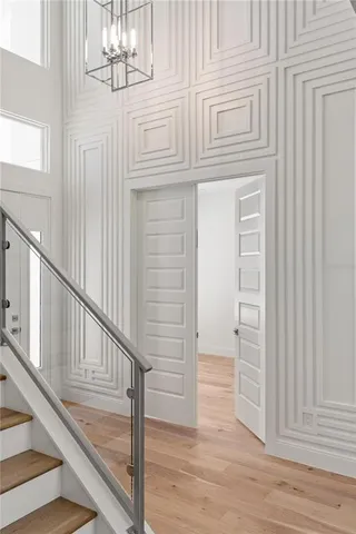 a view of entryway and hall with wooden floor