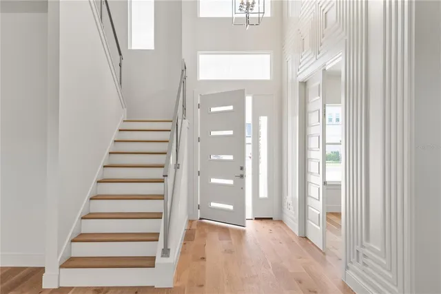 a view of a bathroom with wooden floor and window