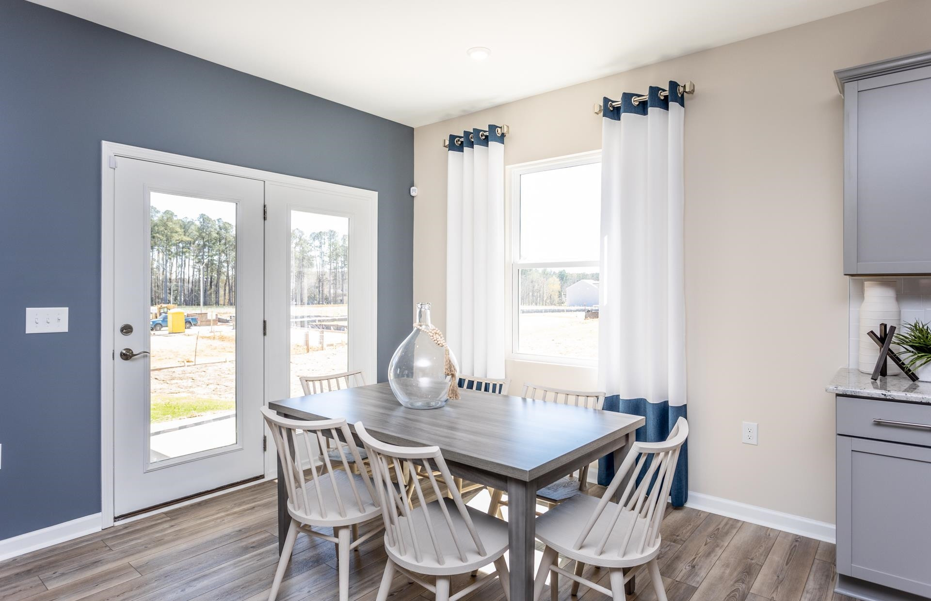 3508 New Town Road Raleigh, NC 27604 - Photo 12 of 27 a view of a dining room with furniture and wooden floor