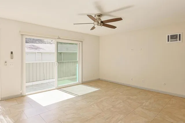an empty room with wooden floor and closet