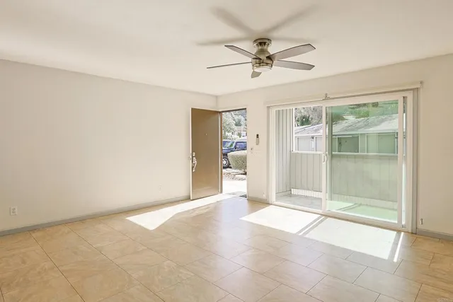 a view of an empty room with a window
